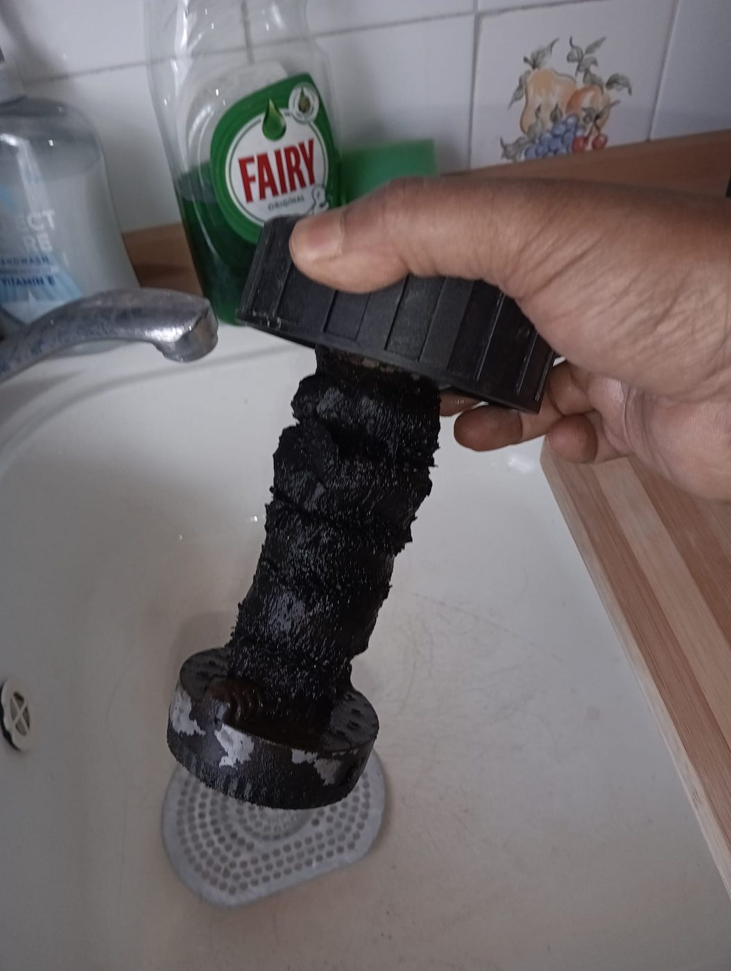 Magnetic filter full of sludge removed during a Vaillant boiler service in Rainham, East London