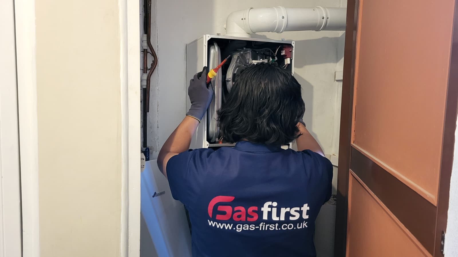 Gas Safe engineer repairing a Worcester Bosch boiler in Dagenham, East London