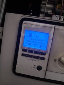 Gas Safe registered engineer diagnosing a Vaillant boiler fault code in Rainham, East London